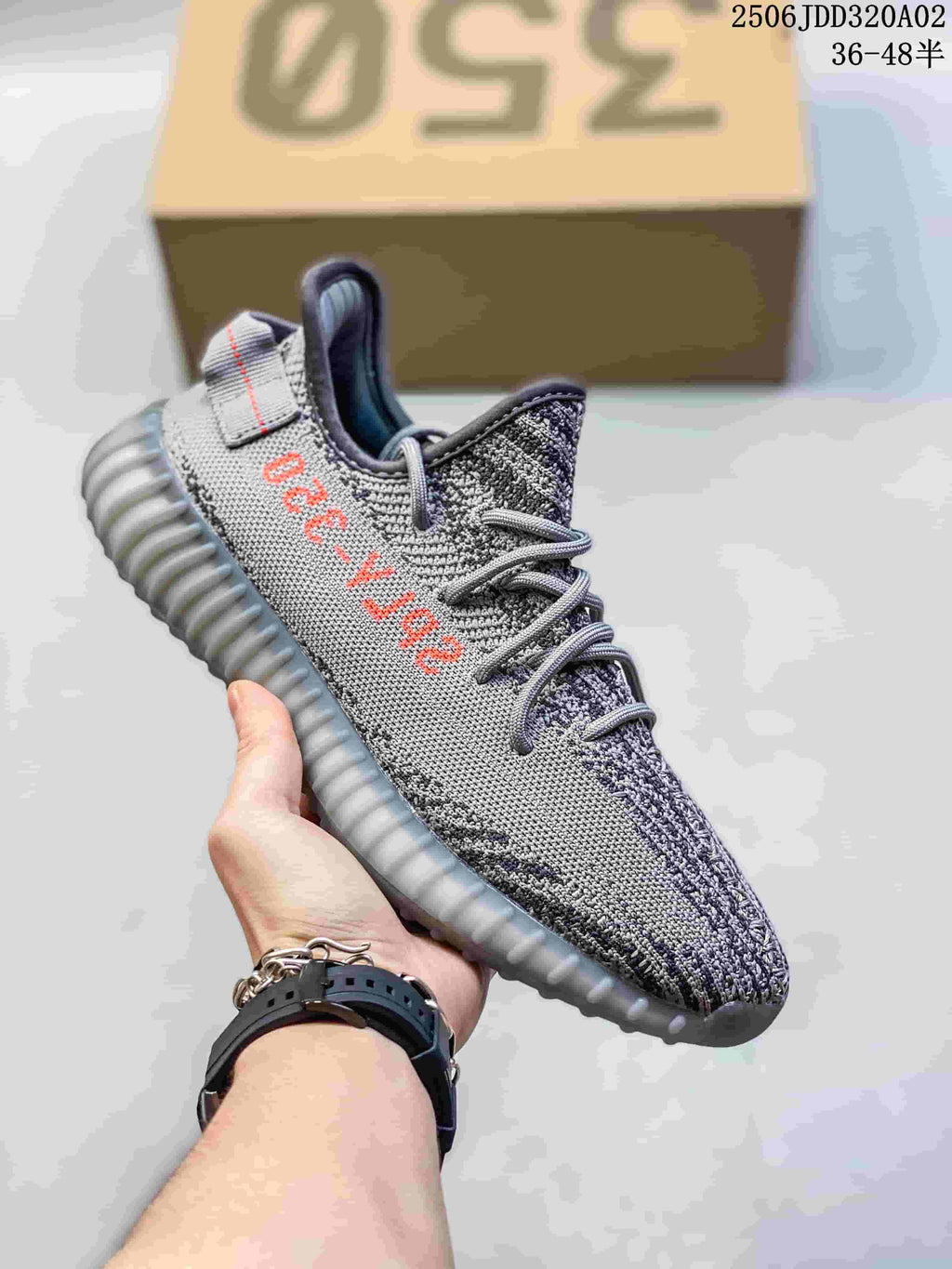 Gray knit sneaker with red side lettering, gray laces, and a translucent gray ribbed sole.
