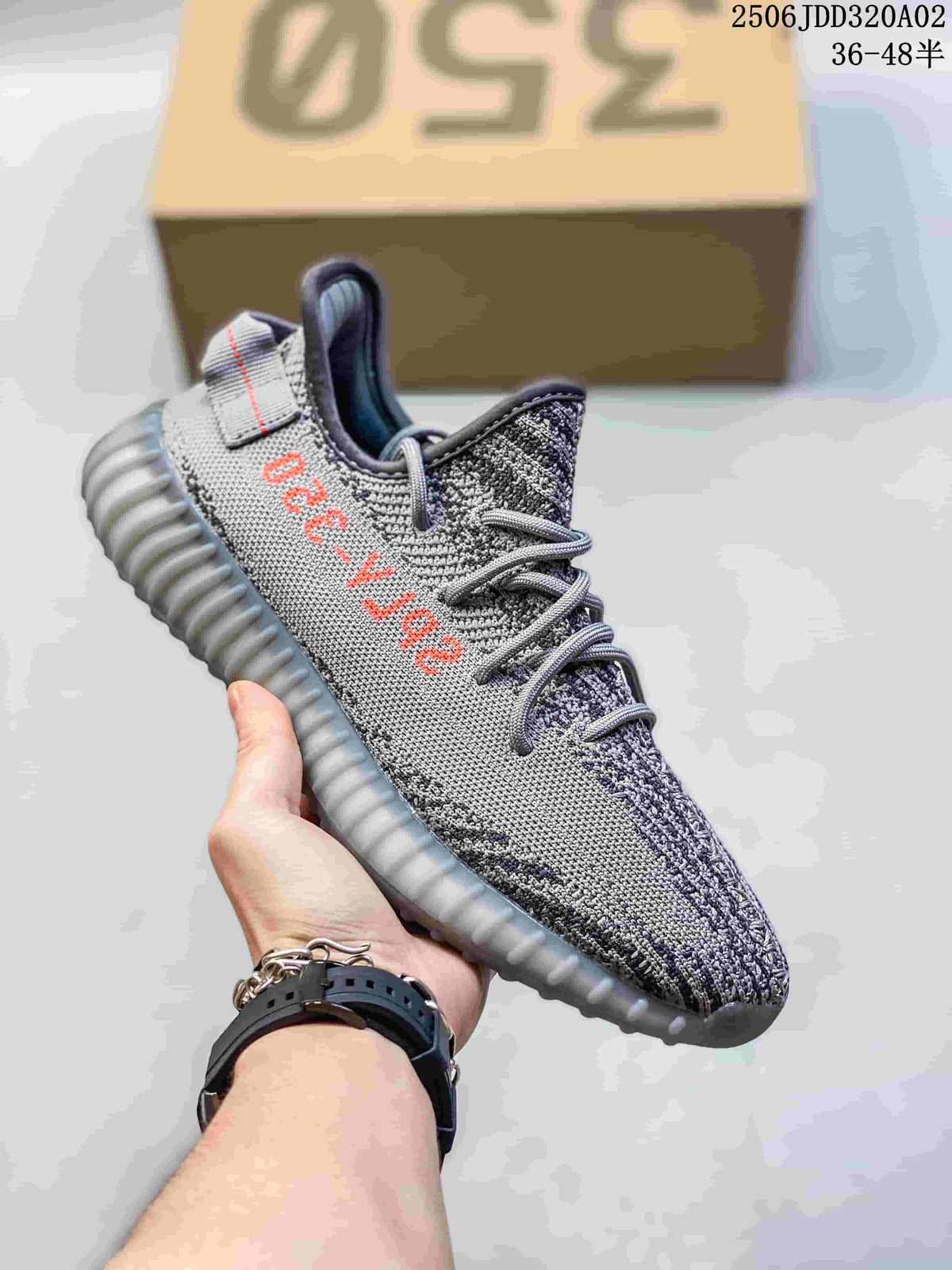 Gray knit sneaker with red side lettering, gray laces, and a translucent gray ribbed sole.
