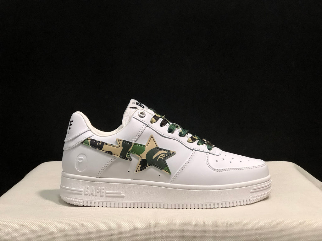 Full side profile of a white sneaker with a green camouflage star panel and BAPE branding on the midsole.
