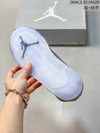 Close-up of the translucent outsole on a grey Jordan high-top sneaker