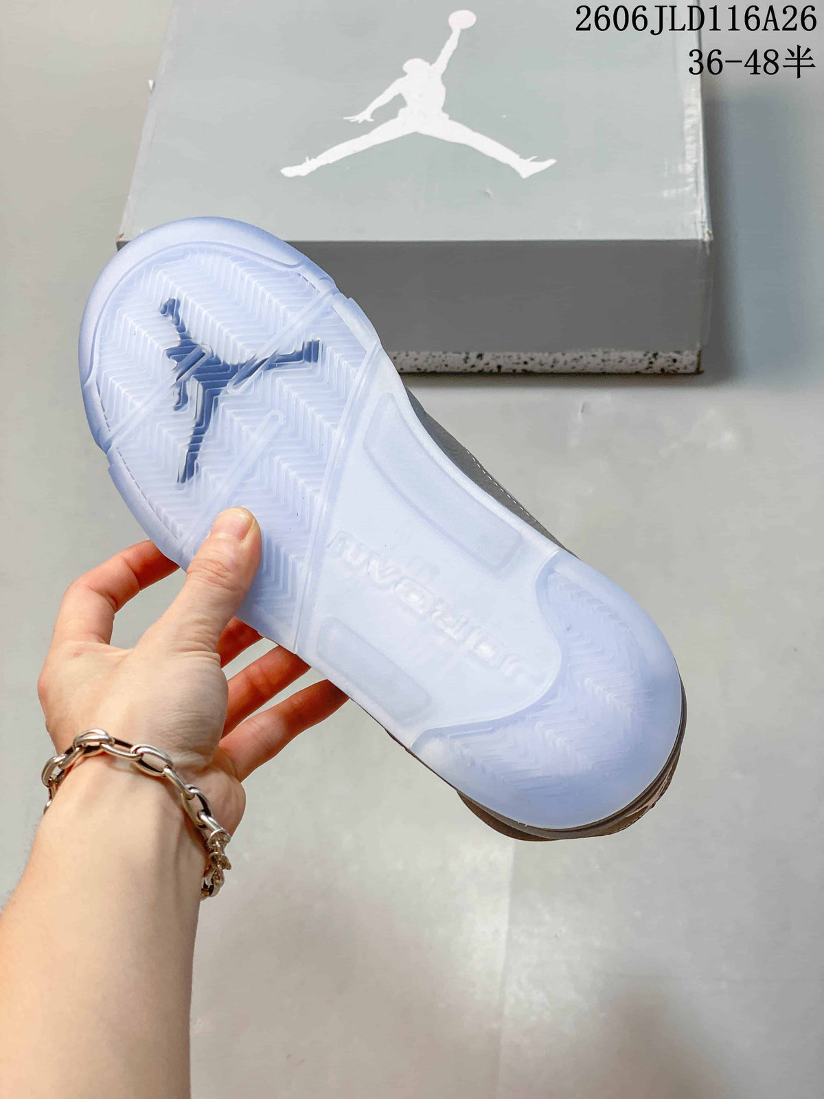 Close-up of the translucent outsole on a grey Jordan high-top sneaker
