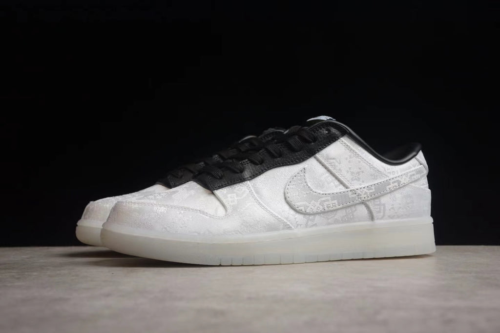 Angled side view highlighting the white patterned panels, side Swoosh, and black collar.