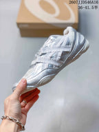 Side profile of a silver and white ASICS Hypersync sneaker showing layered panels, laces, low-profile construction, and circular outsole details.