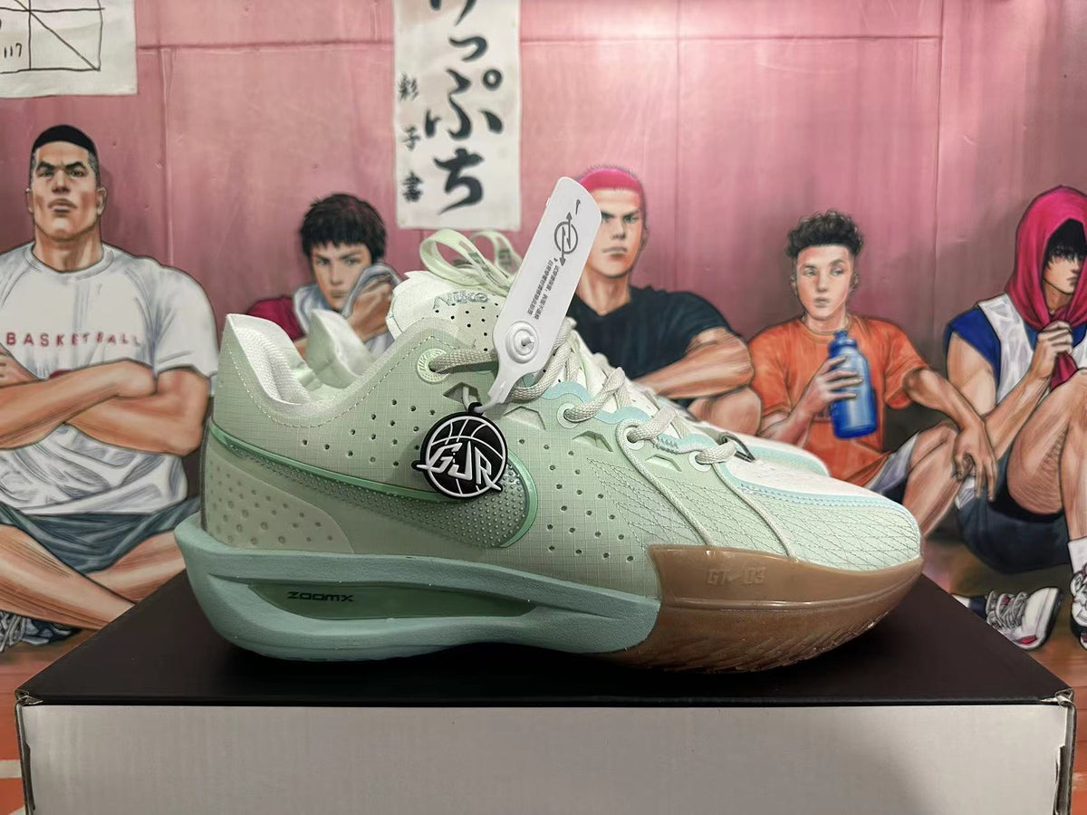 Side view of a pale green Nike G.T. Jump 2 basketball shoe with visible ZoomX midsole marking