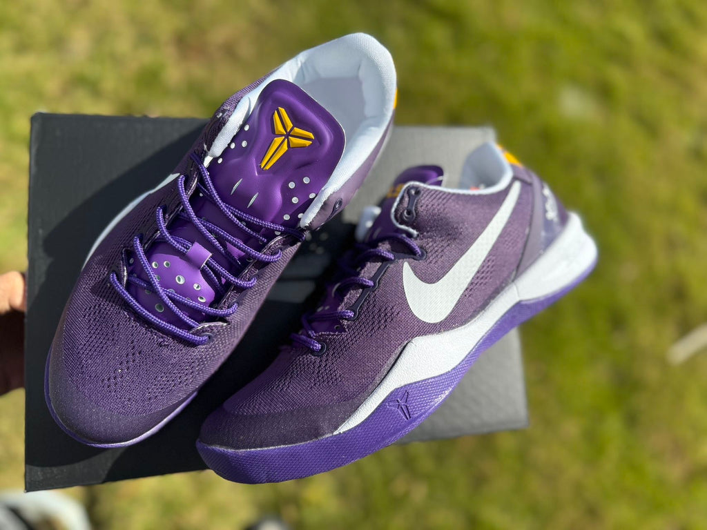 Close view of the purple Kobe 8 shoe, laces and tongue detail.