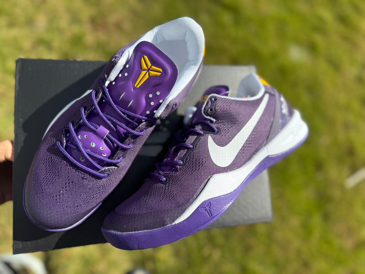 Close view of the purple Kobe 8 shoe, laces and tongue detail.