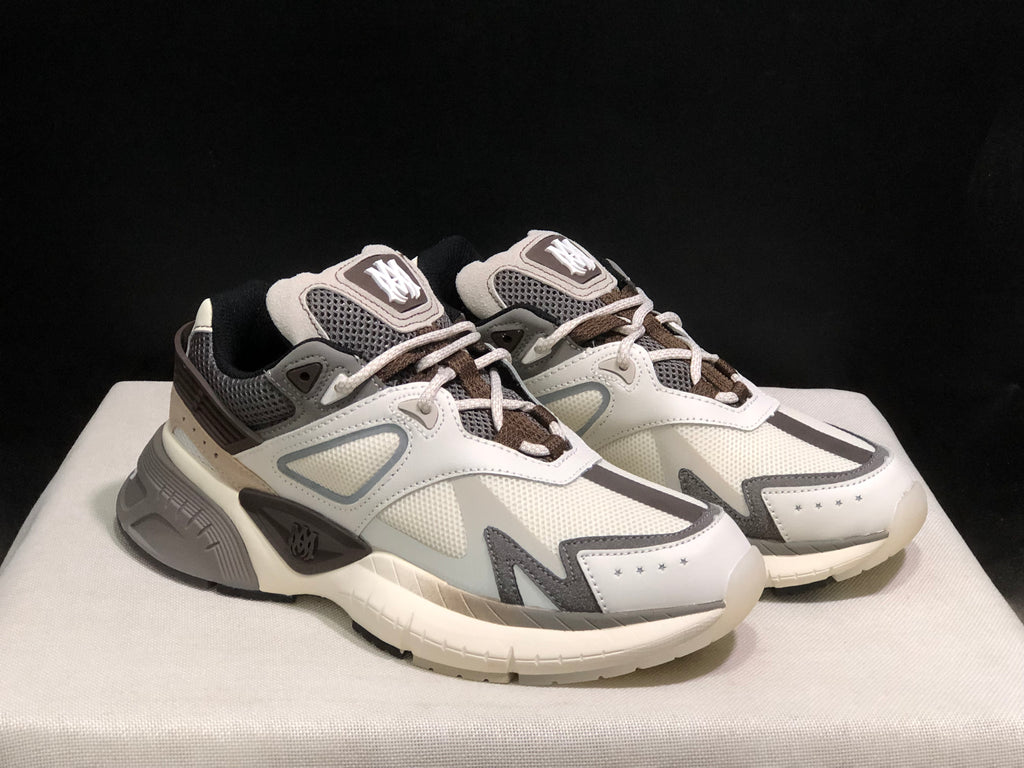 Pair of AMIRI MA Runner sneakers shown from a front three-quarter angle.