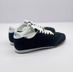 Rear three-quarter view showing white heel panels and black sneaker uppers.