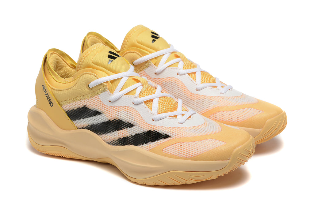 Pair of yellow Adidas Adizero shoes with black stripes, shown at an angle