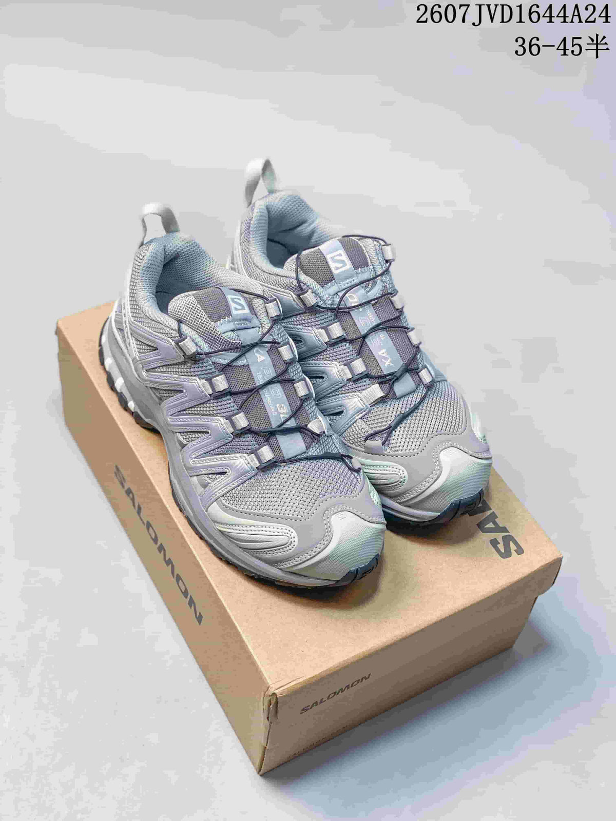 Pair of gray Salomon XA Pro 3D Seasonal sneakers displayed on a Salomon shoebox.
