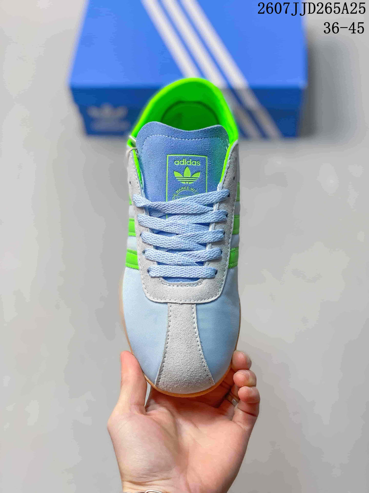 Top view showing the blue laces, light contrasting panels and adidas tongue branding.