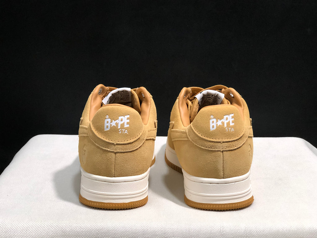 Rear view of the pair showing BAPE STA heel branding, padded collars and white midsoles.