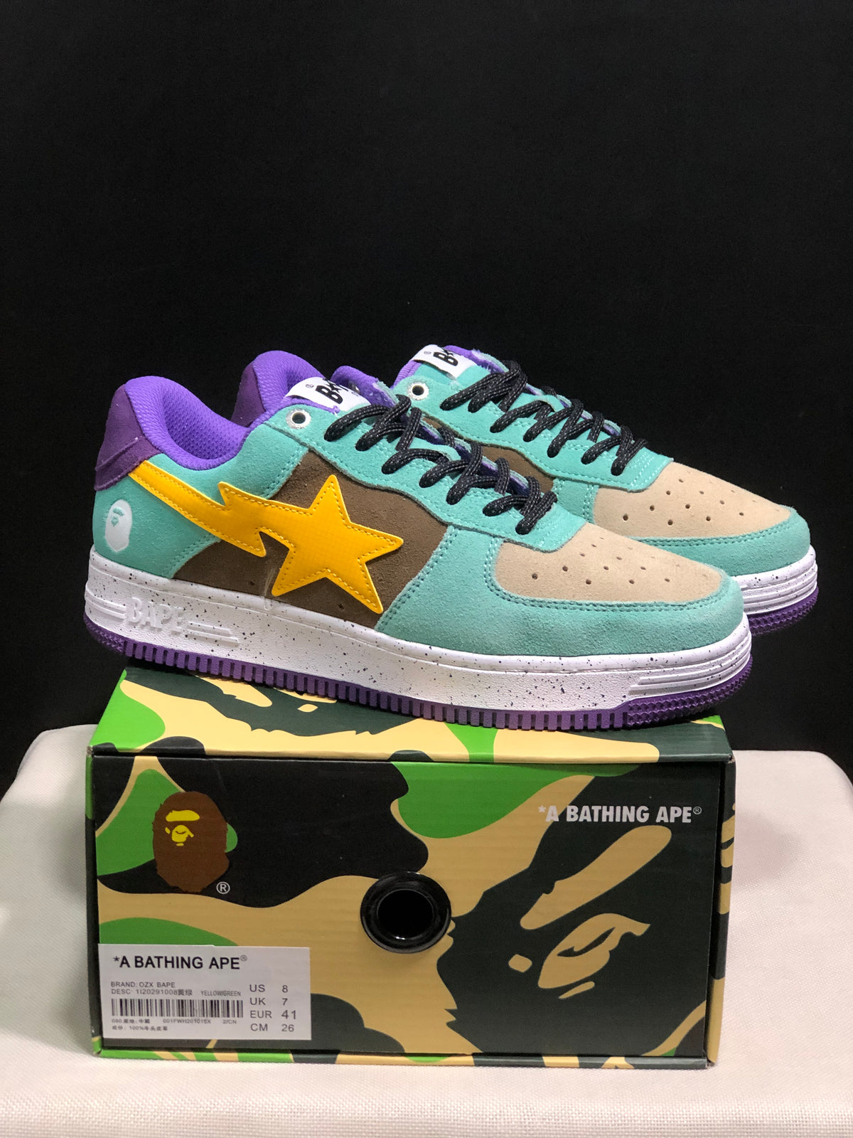 Pair of multicolor Bape Sta low-top sneakers displayed above a branded shoe box; the box label shows EU 41, UK 7, US 8, and CM 26 for the photographed sample.
