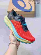 Red ASICS GEL-TRABUCO 13 trail shoe with blue and yellow-green accents