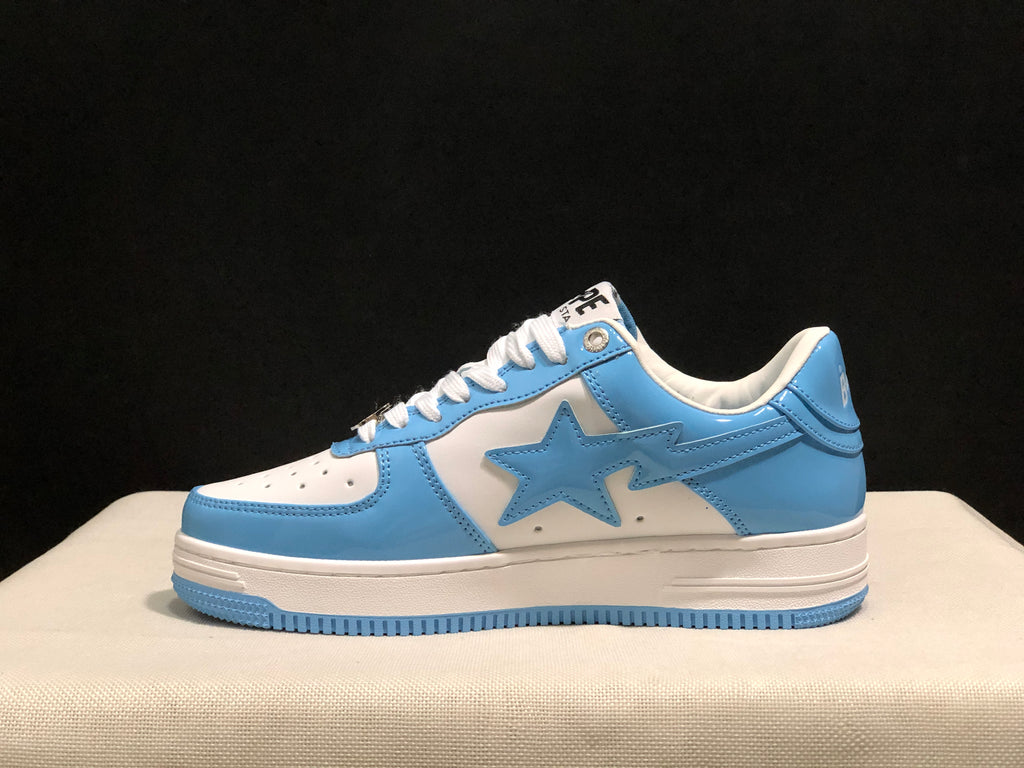 Side profile showing the low-top silhouette, blue star panel, white midsole, and blue outsole.