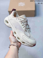 Angled side view of the off-white On sneaker with layered overlays and burgundy outsole details.