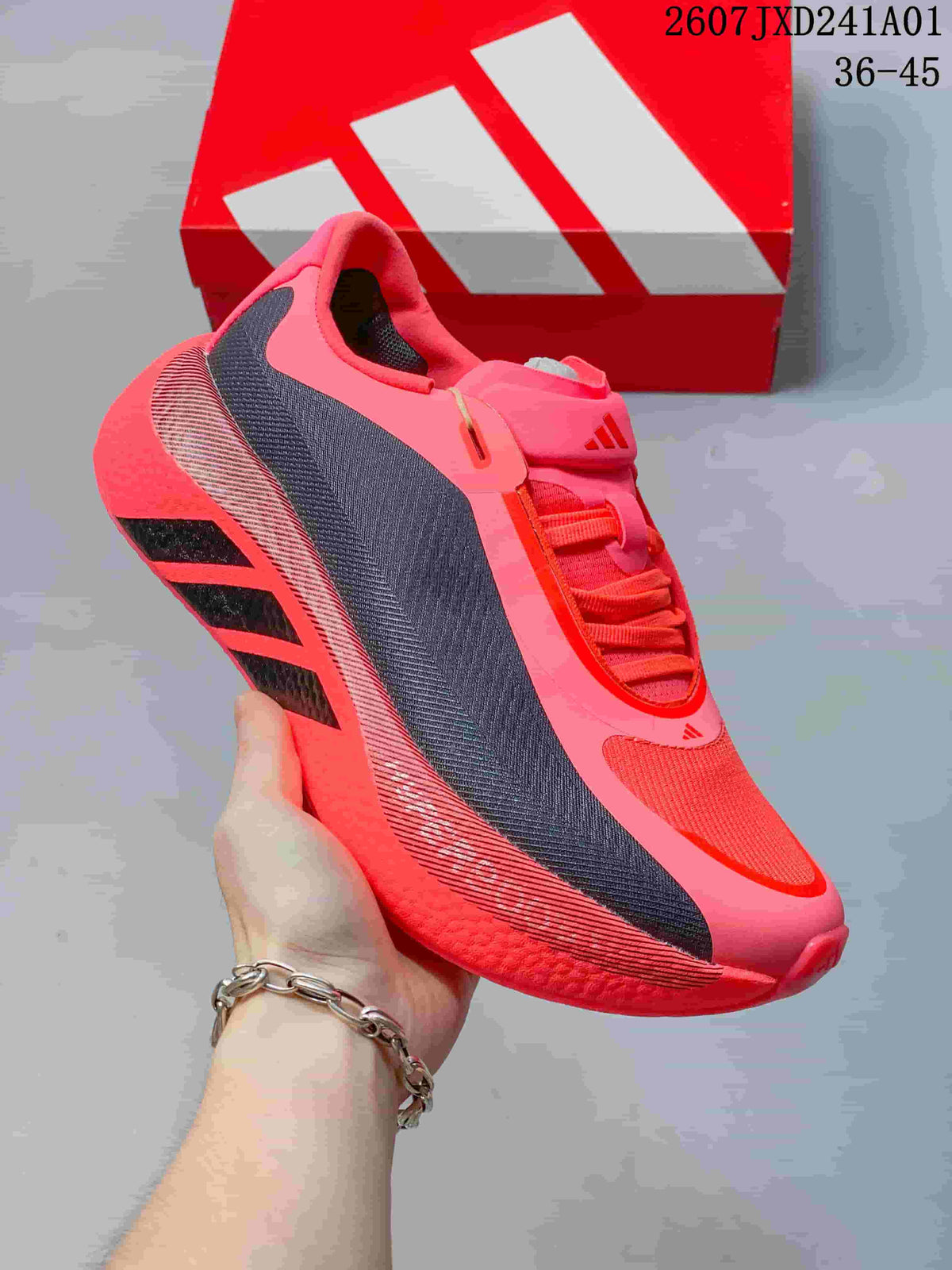 Angled side view highlighting the pink upper, dark panels, and textured sole