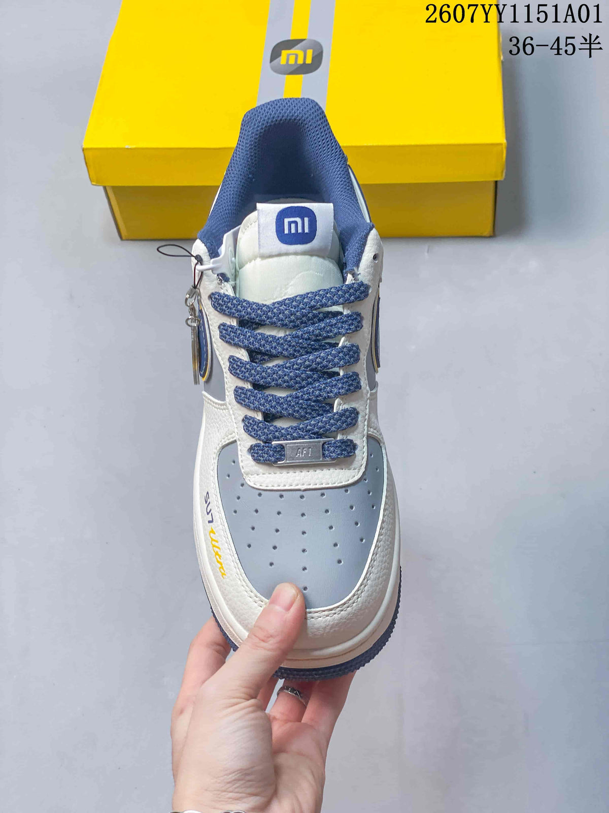 Front view showing blue laces, a blue-gray perforated toe panel, and Xiaomi-branded tongue detail.