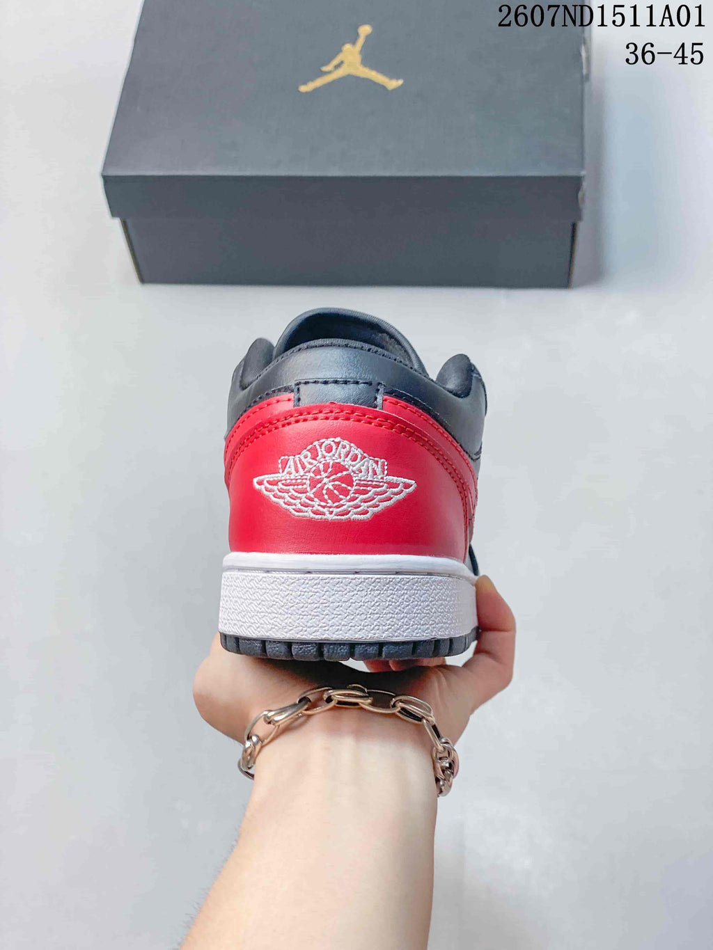 Rear view showing the red heel panel and embroidered Jordan Wings logo
