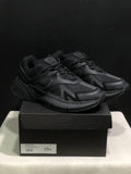 Pair of black AMIRI MA Runner sneakers displayed on a branded shoe box; the box label shows size 41.
