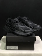 Pair of black AMIRI MA Runner sneakers displayed on a branded shoe box; the box label shows size 41.