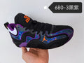 Black Jordan basketball shoe with purple trim, multicolored side panels, and orange accents