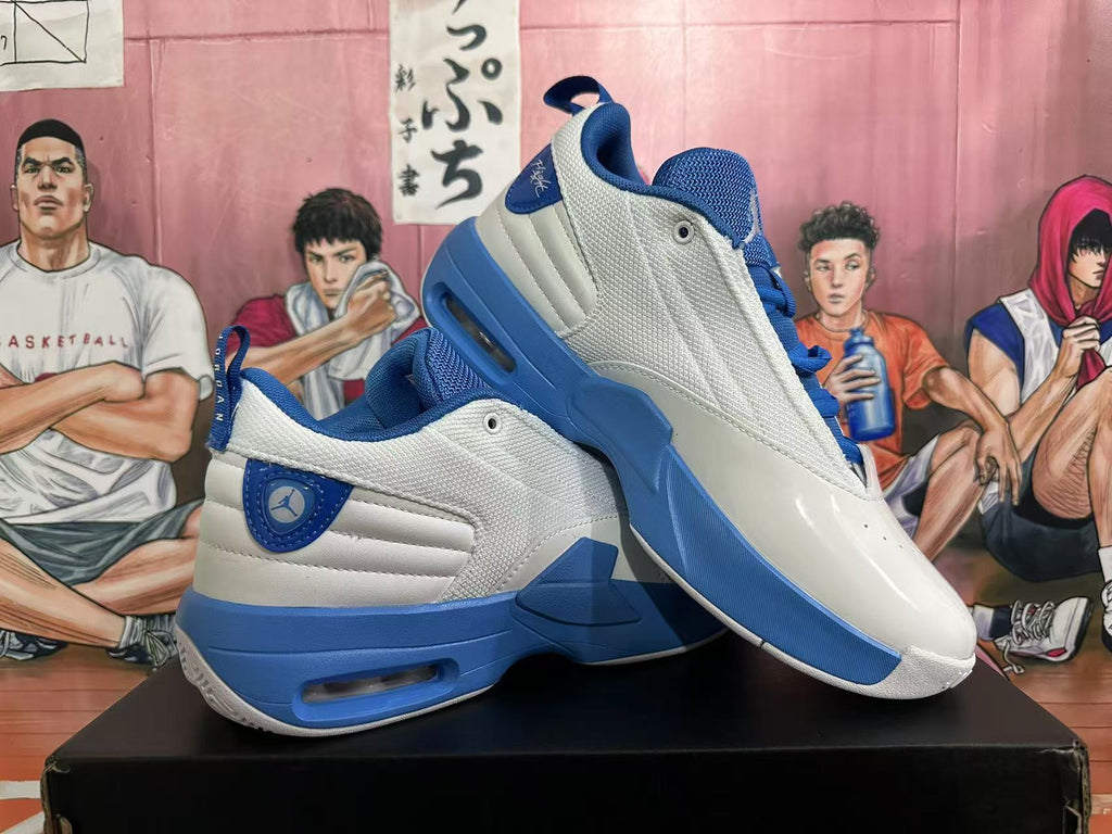 Angled view of paired white and blue Jordan sneakers showing the side panels, blue midsoles, and heel details.