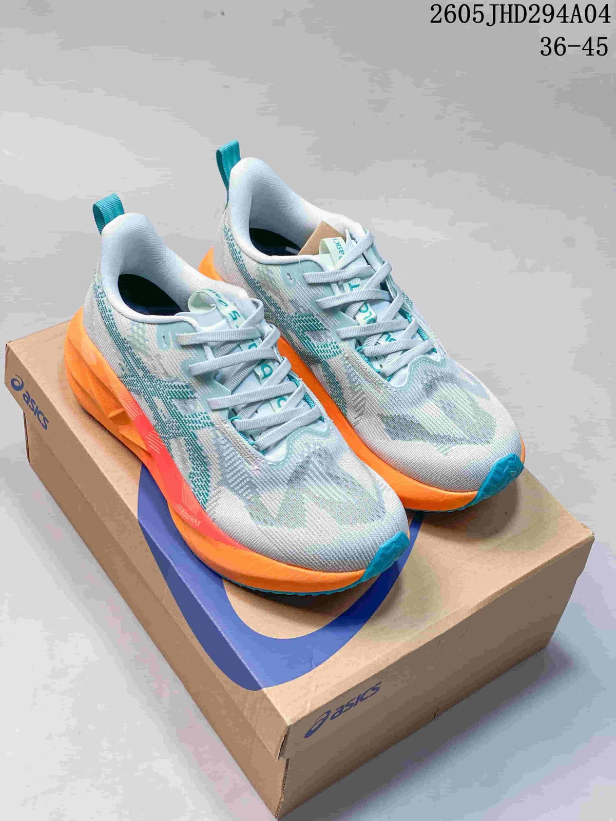 Pair of light grey and teal ASICS NOVABLAST 5 LE running shoes with orange midsoles, shown on a shoe box