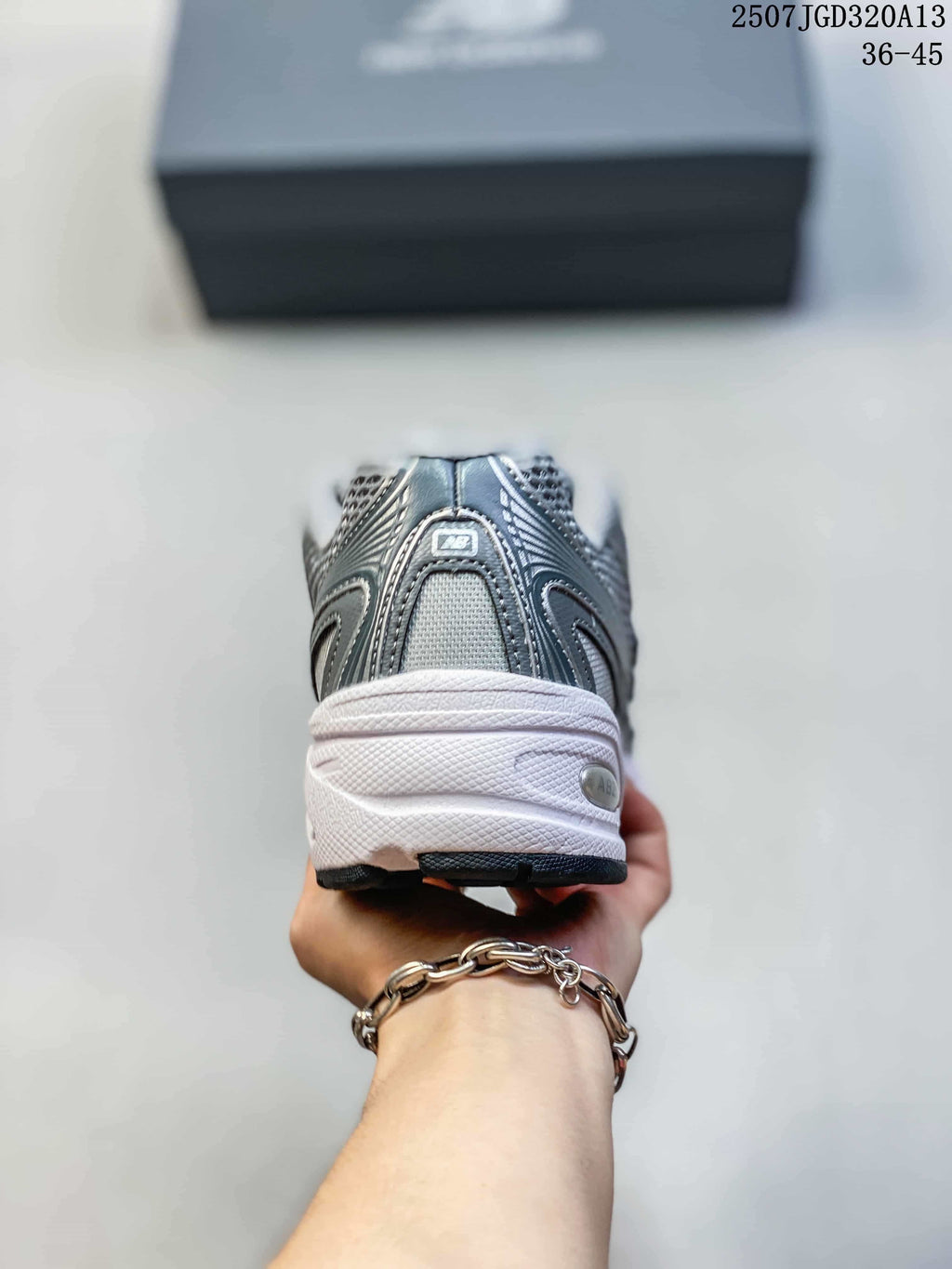Rear view showing the padded heel and layered grey upper of the sneaker.