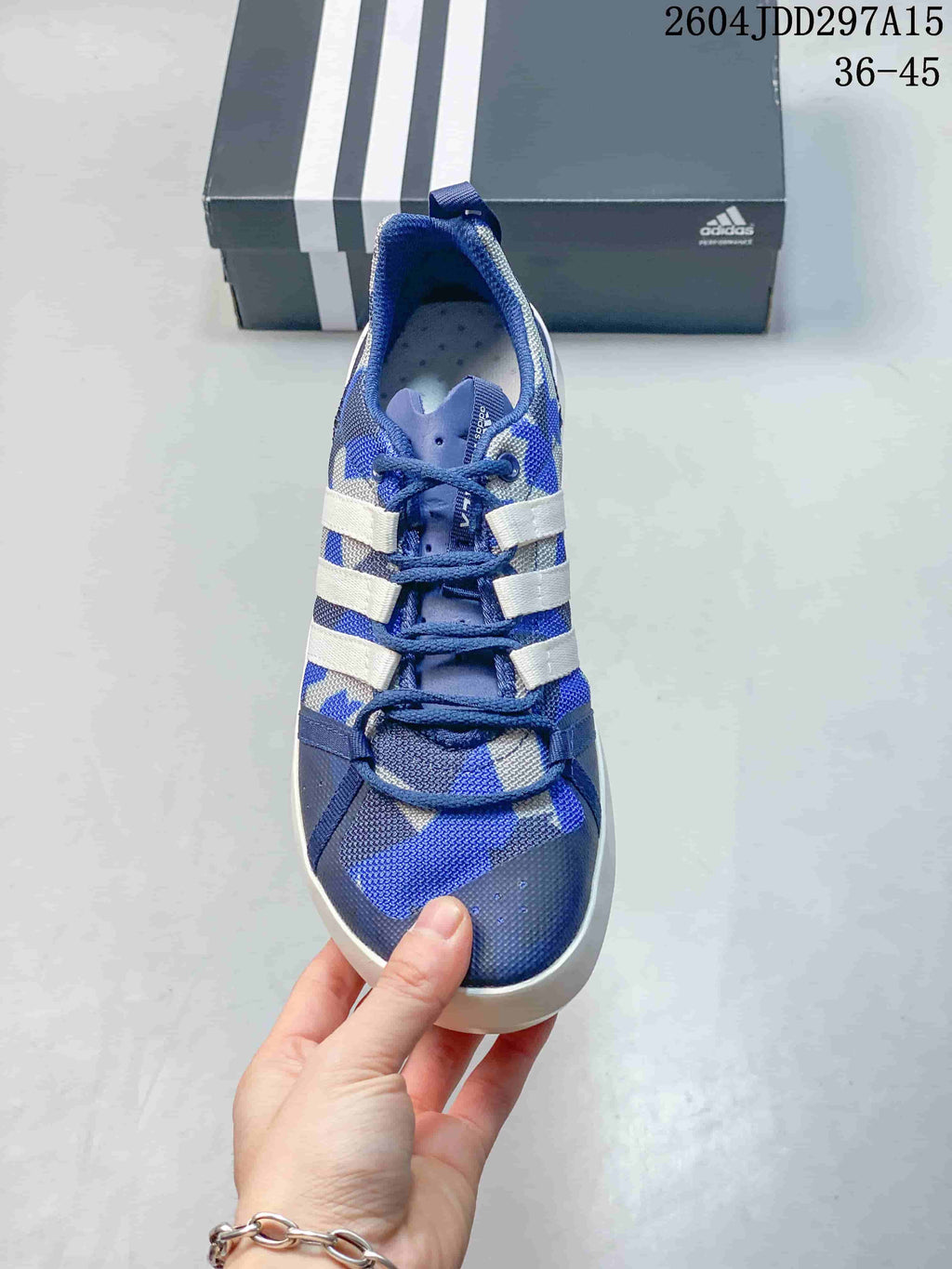 Top view of the blue shoe showing the lace-up construction, perforated-looking insole and patterned upper.