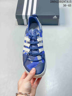 Top view of the blue shoe showing the lace-up construction, perforated-looking insole and patterned upper.
