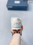 Rear view showing the ivory heel and textured rubber outsole of the sneaker.