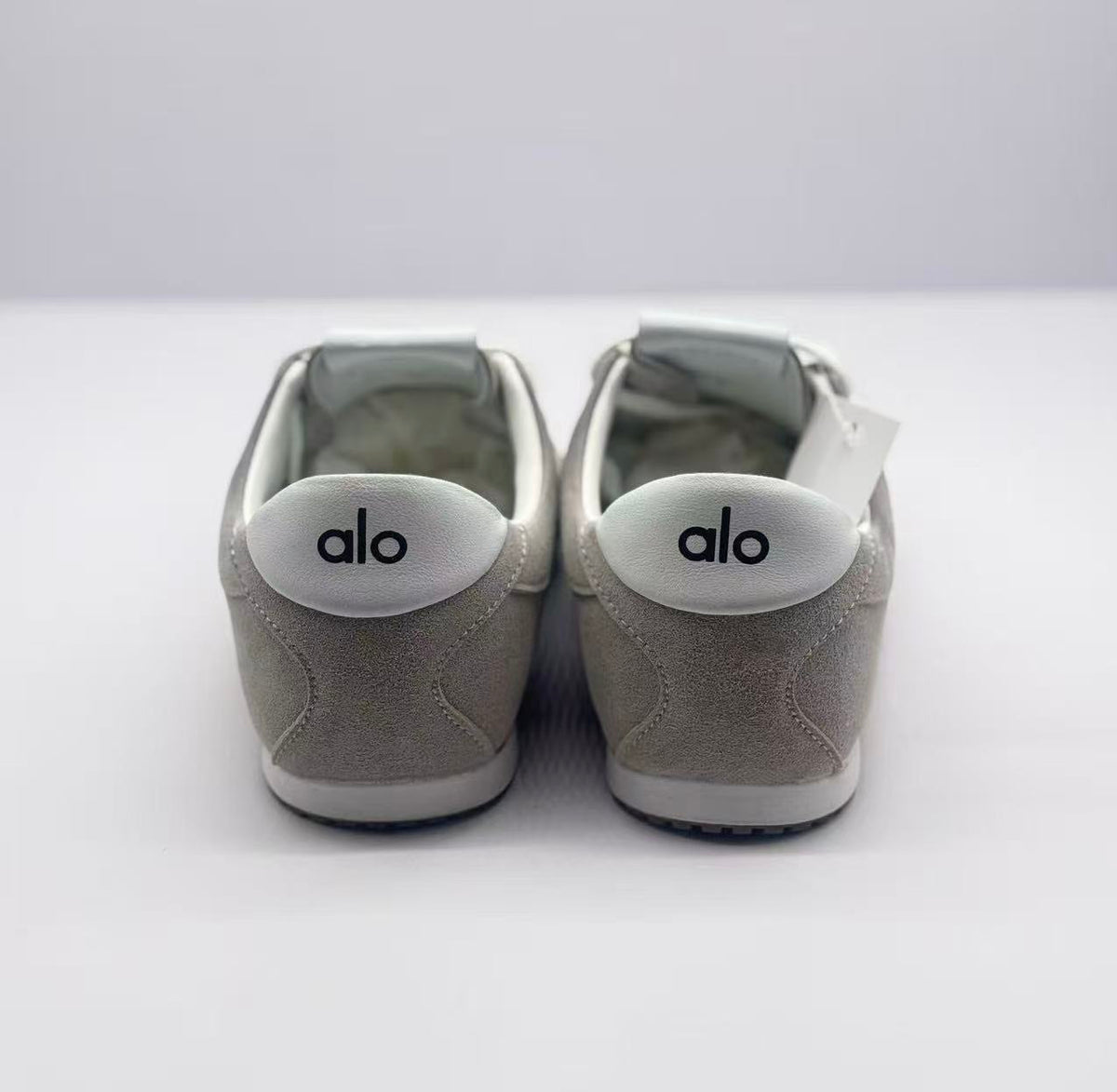 Rear view of the pair showing matching white oval heel branding.