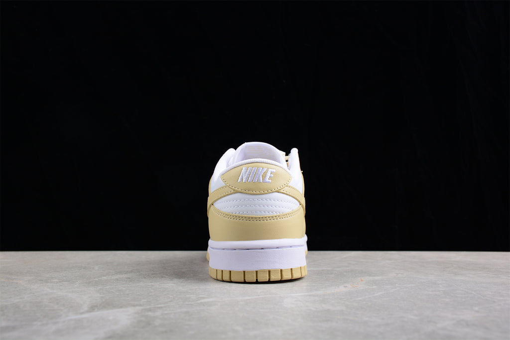 Rear view showing the cream heel panel, white heel detail, and white midsole.