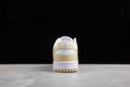 Rear view showing the cream heel panel, white heel detail, and white midsole.