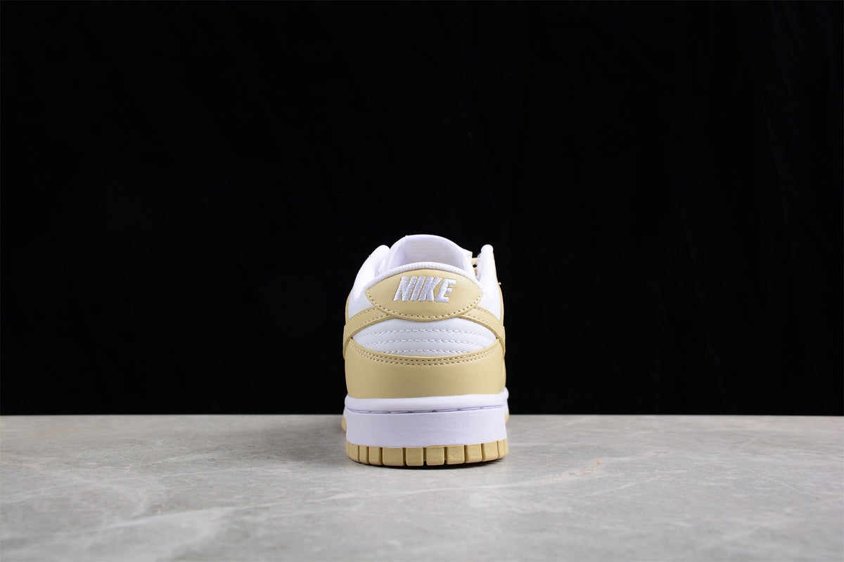 Rear view showing the cream heel panel, white heel detail, and white midsole.