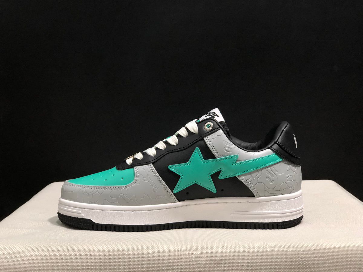 Side profile highlighting the turquoise star emblem, grey textured overlays and black outsole.