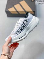 Side view showing the white upper, black Adidas stripes, lace-up construction and thick white midsole.