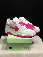 Pair of white and pink Off-White Out Of Office sneakers displayed on a green shoe box with a pink tag accessory.