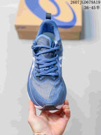 Top view of the blue sneaker showing the lace arrangement, padded tongue, textured toe box, and ASICS branding.