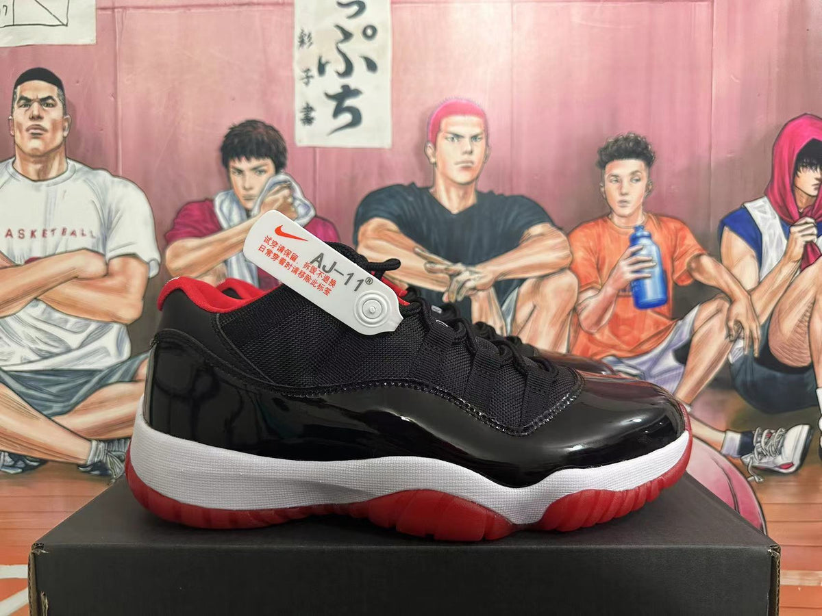 Side view of a black and red Air Jordan 11 sneaker with a visible AJ-11 tag.