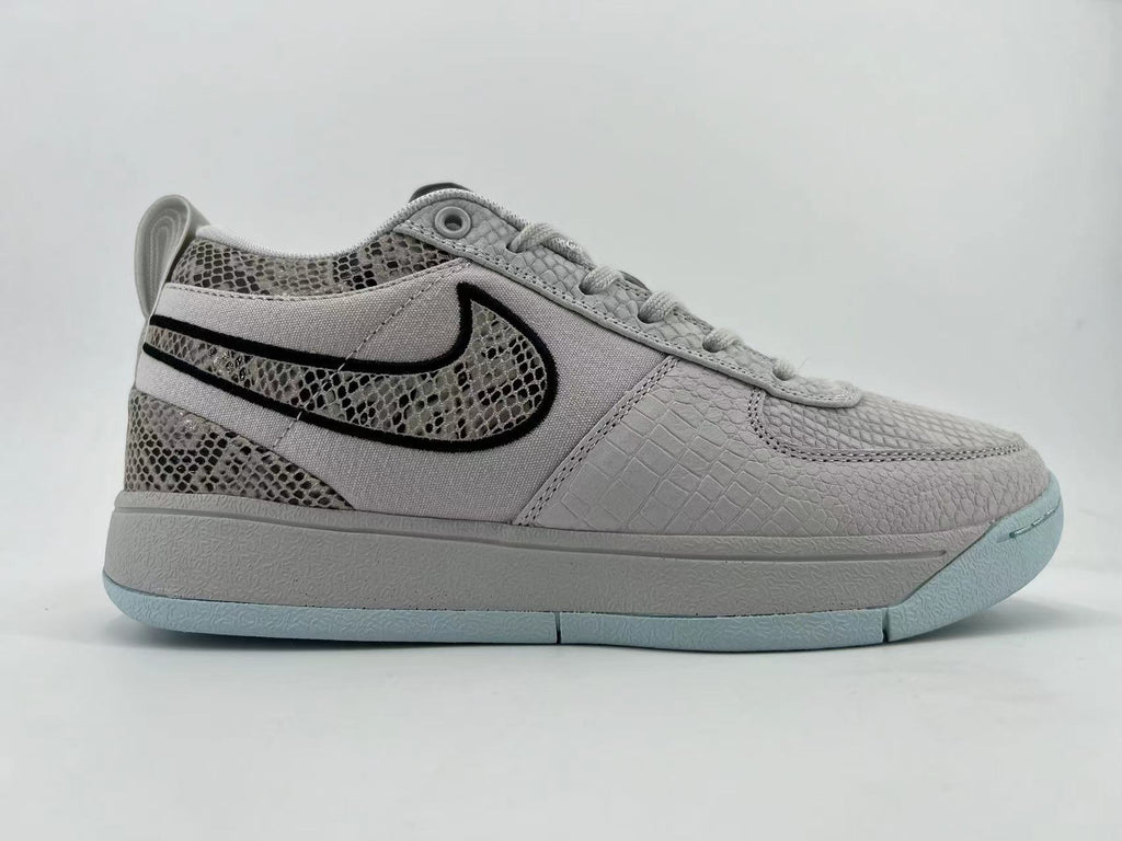 Opposite side profile of the gray sneaker with pale blue outsole