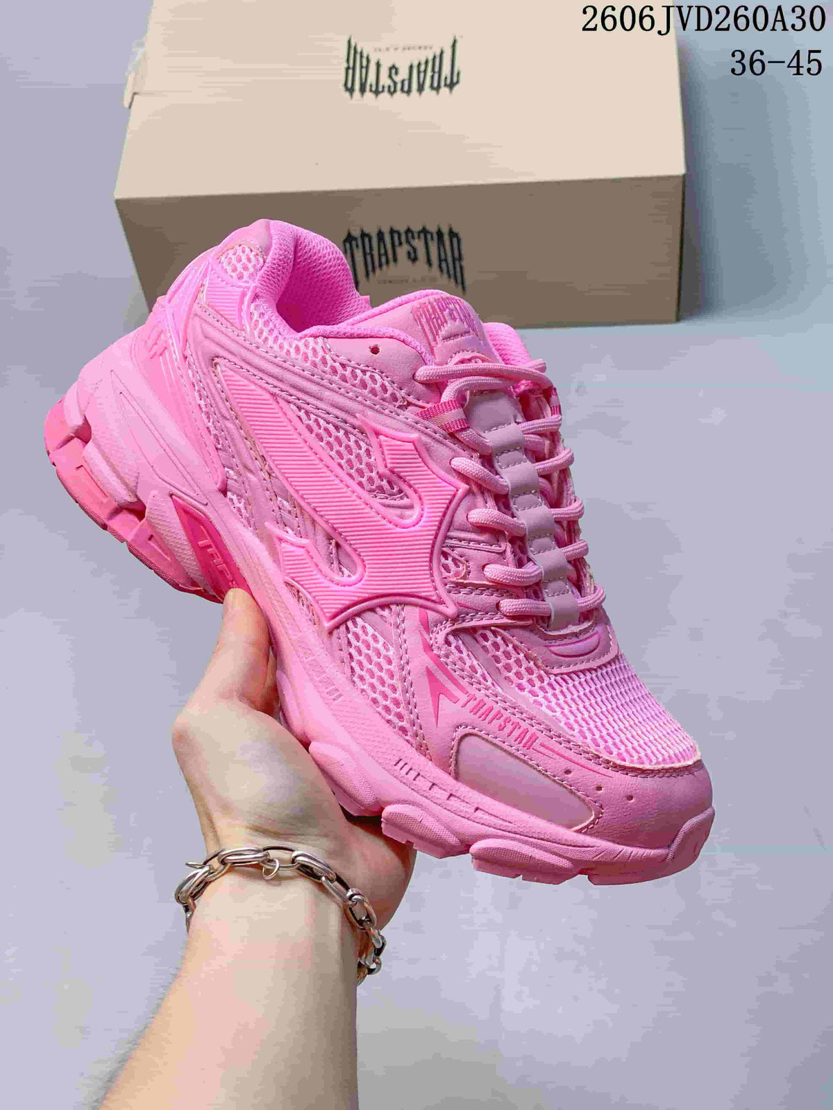 Pink Trapstar Trispeed 3000 sneaker with mesh panels and a chunky sole.