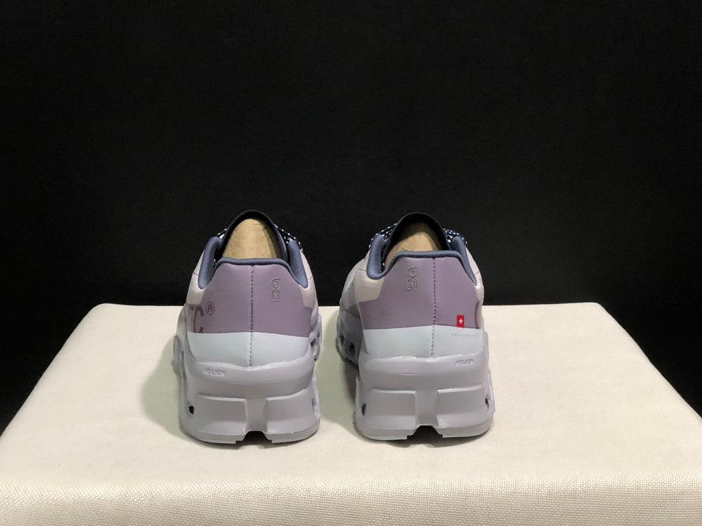 Rear view showing purple-gray heel panels on the On Cloud X sneakers