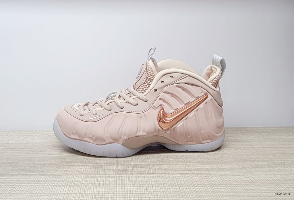 Side view of the sneaker showing its rose-gold-tone accent and lace-up design