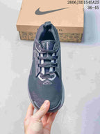 Top view of a dark gray Nike Pegasus Trail shoe with laces