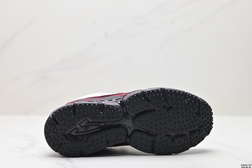 Underside view showing the black outsole with segmented panels and raised lugged tread.