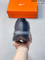 Rear view showing the heel and outsole of a dark gray running shoe.