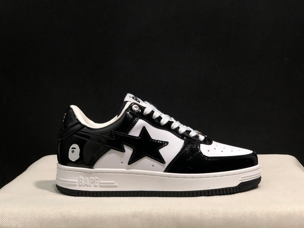 Outer side view showing the star-shaped side detail, heel emblem, white midsole and black outsole.