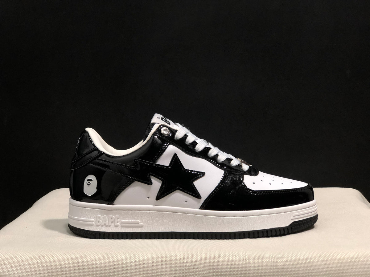 Outer side view showing the star-shaped side detail, heel emblem, white midsole and black outsole.